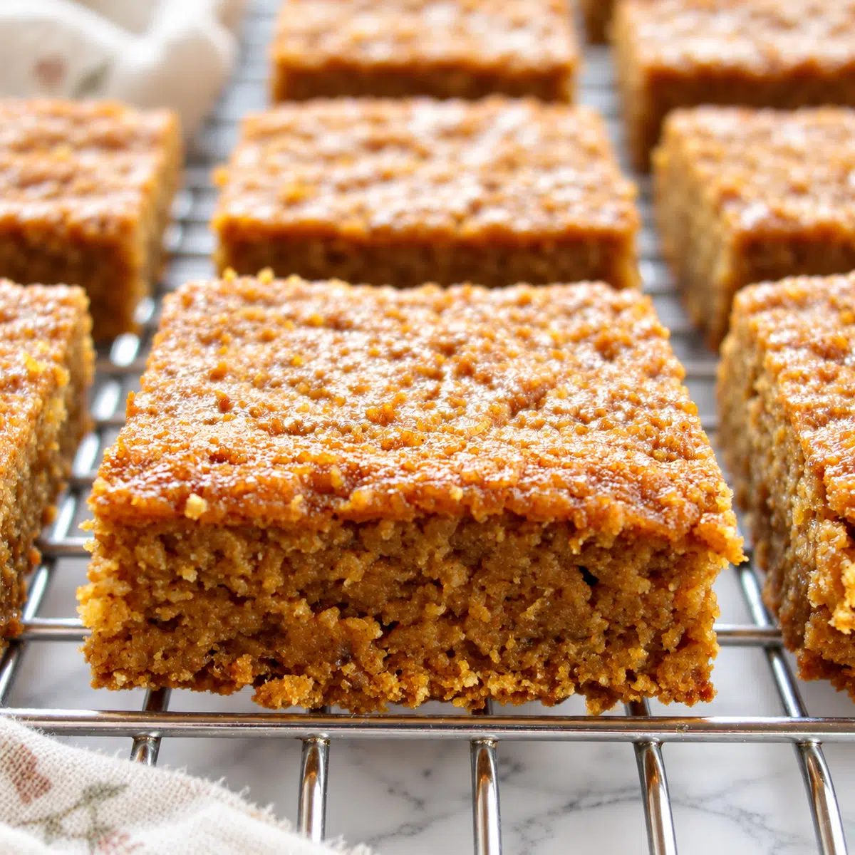 close up of vegan pumpkin pie bars on cooling rack