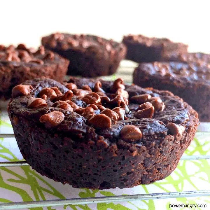 close up of 5 zucchini brownies on a metal cooling rack
