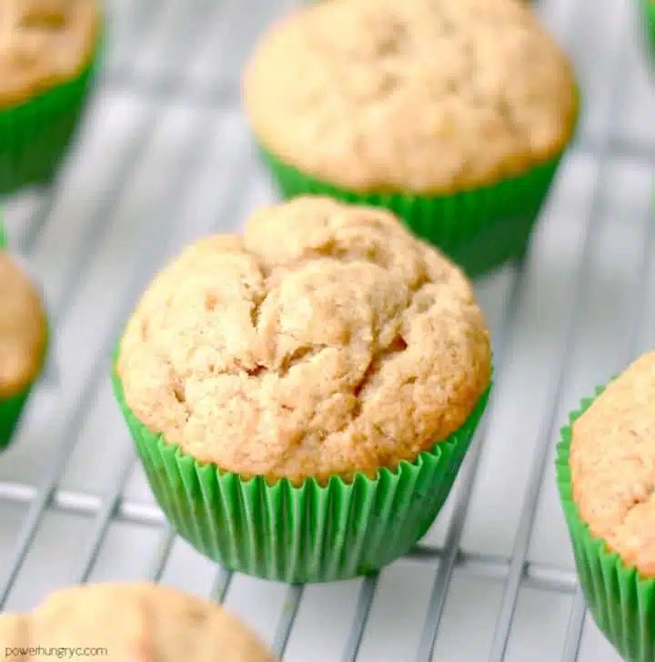 coconut-lime chickpea flour muffins on a silver cooling rack