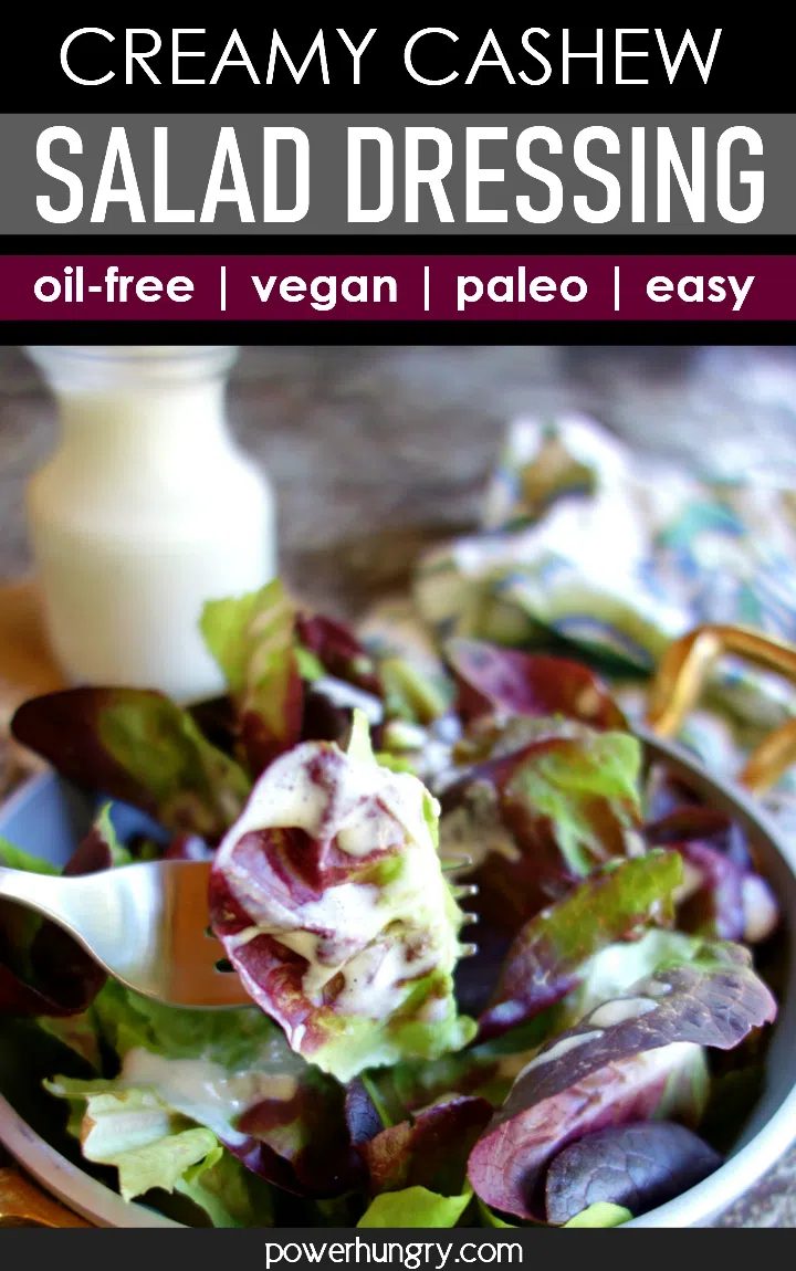 Cashews salad dressing drizzled over salad greens
