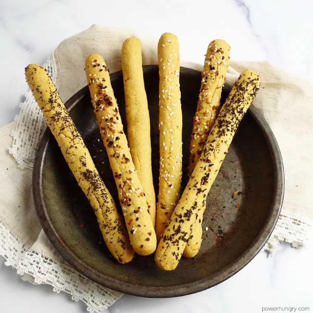 chickpea flour breadsticks in an antique tin