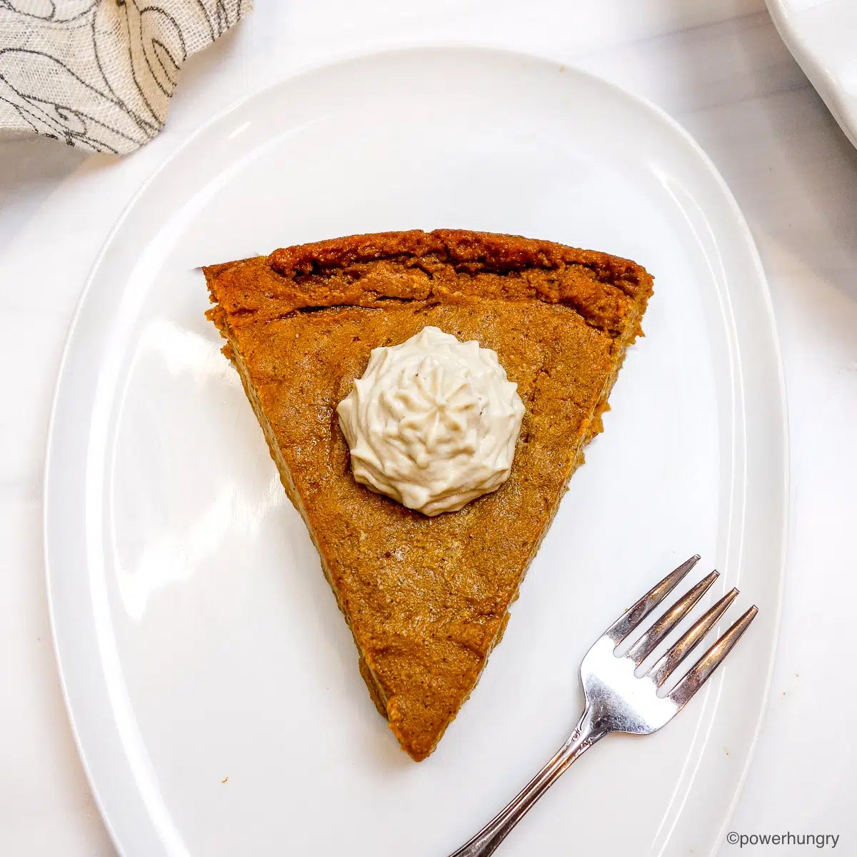 sunflower seed no crust vegan gluten-free pumpkin pie on a white plate