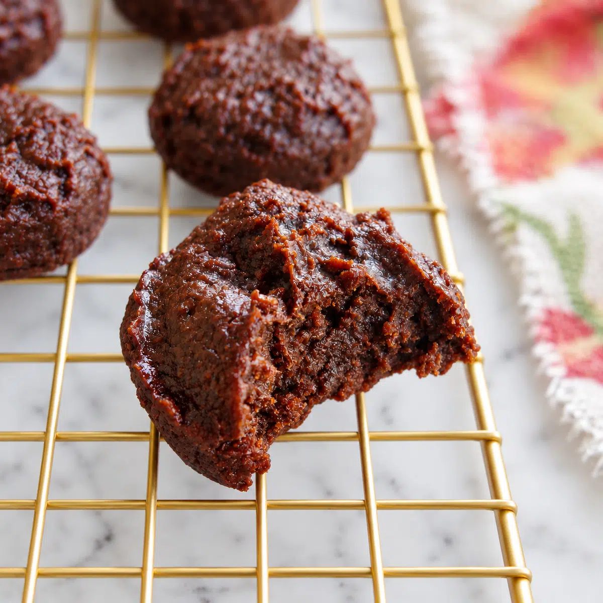 close up of a bitten date brownie on a cooling rack