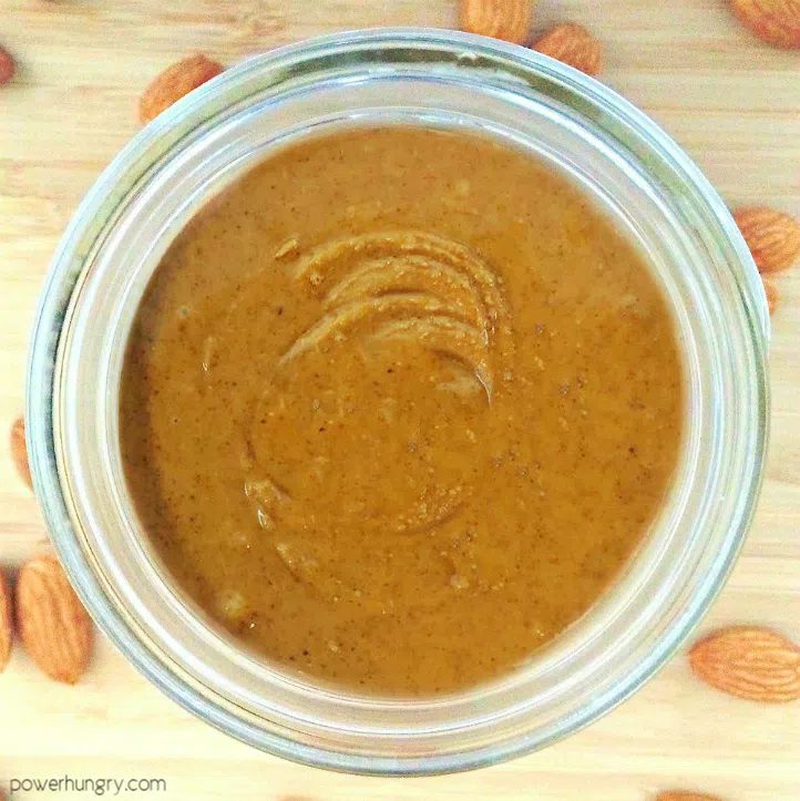 overhead shot of diy almond butter in a glass jar