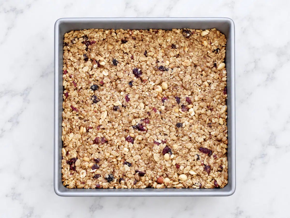 Chill and cut. Let the mixture cool slightly, then refrigerate for at least 30 minutes. Lift it from the pan and cut into 8 bars with a sharp knife. pressed in pan