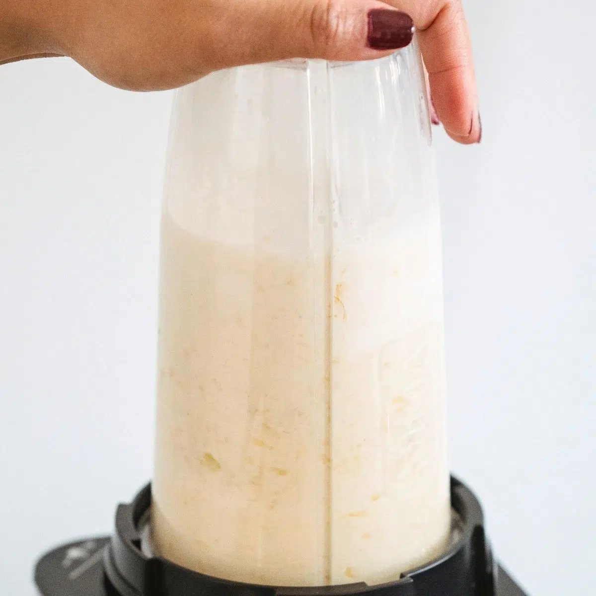 bullet blender filled with coconut butter