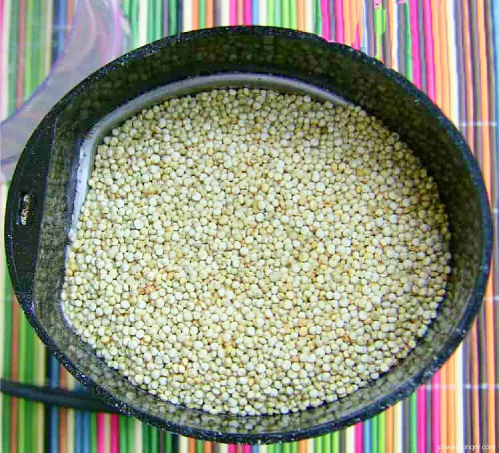 quinoa seeds in a coffee grinder