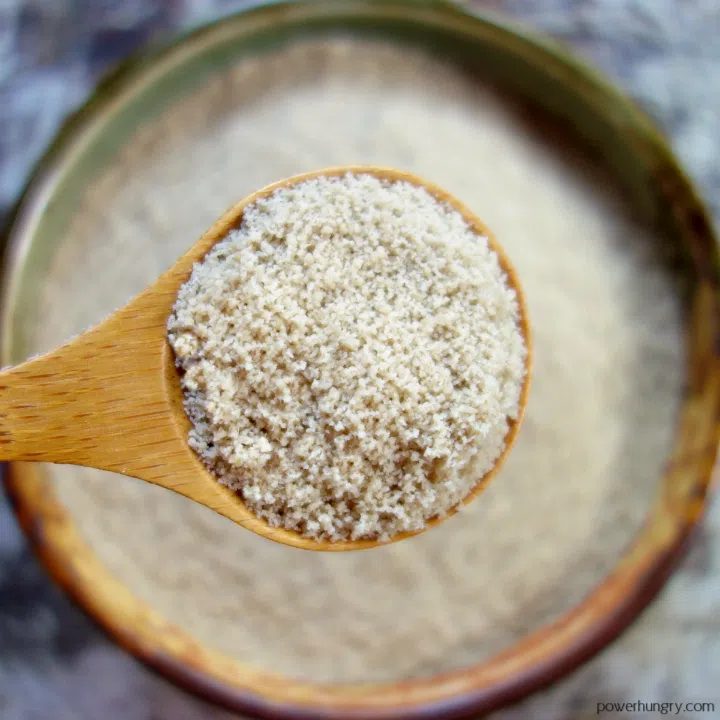 close up of a wooden spoon with extra-fine sunflower seed flour