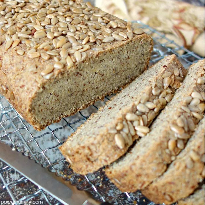 sunflower seed flour bread on a cooling rack, cut in slices