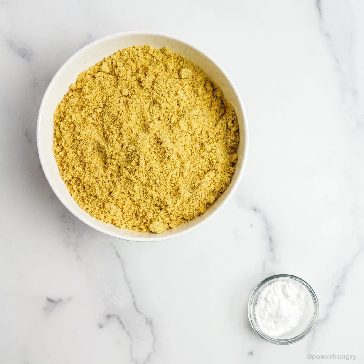 the two ingredients for 2 ingredient flax rolls on a white marble surface