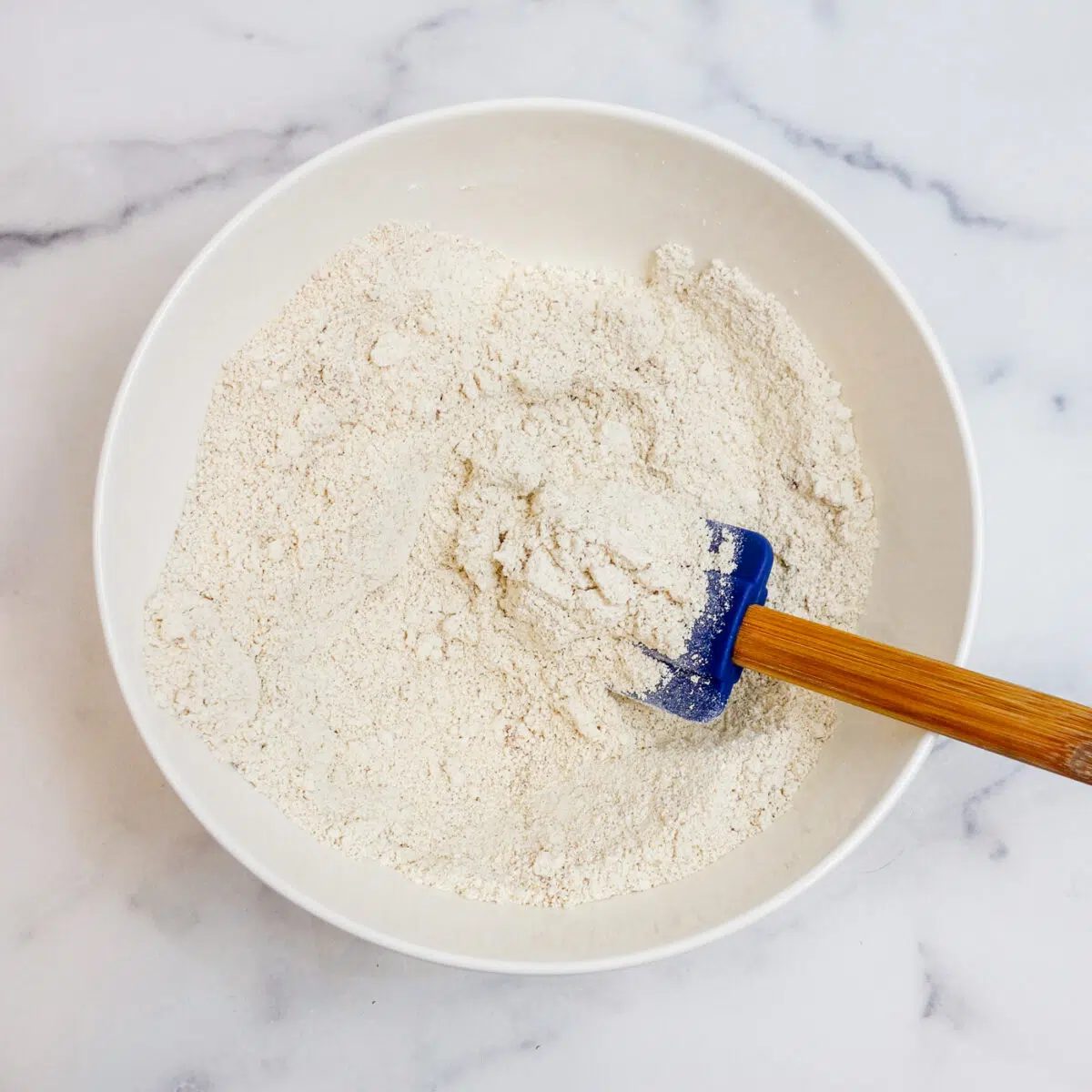 dry ingredients for oat scones in a white bowl