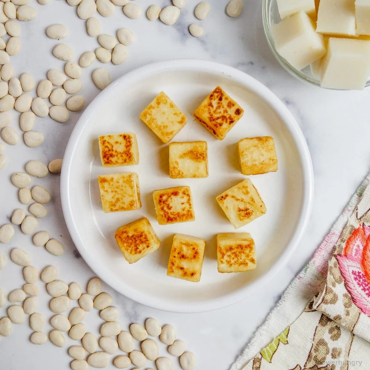 pan fried lime bean tofu on a white plate