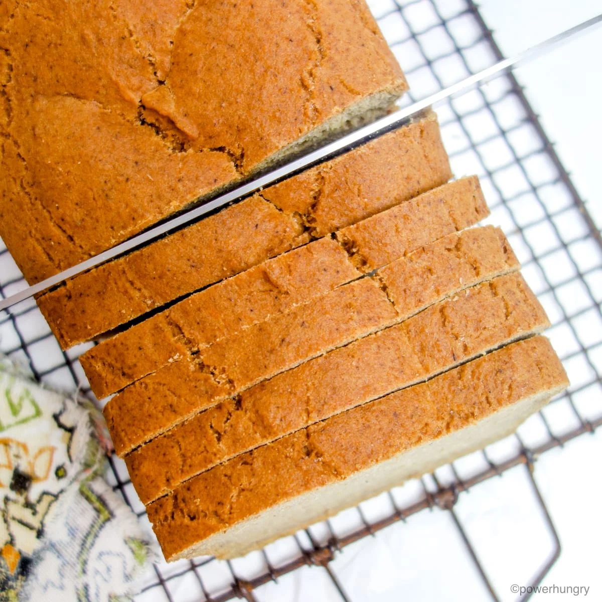 overhead shot of thickly sliced lentil sunflower bread