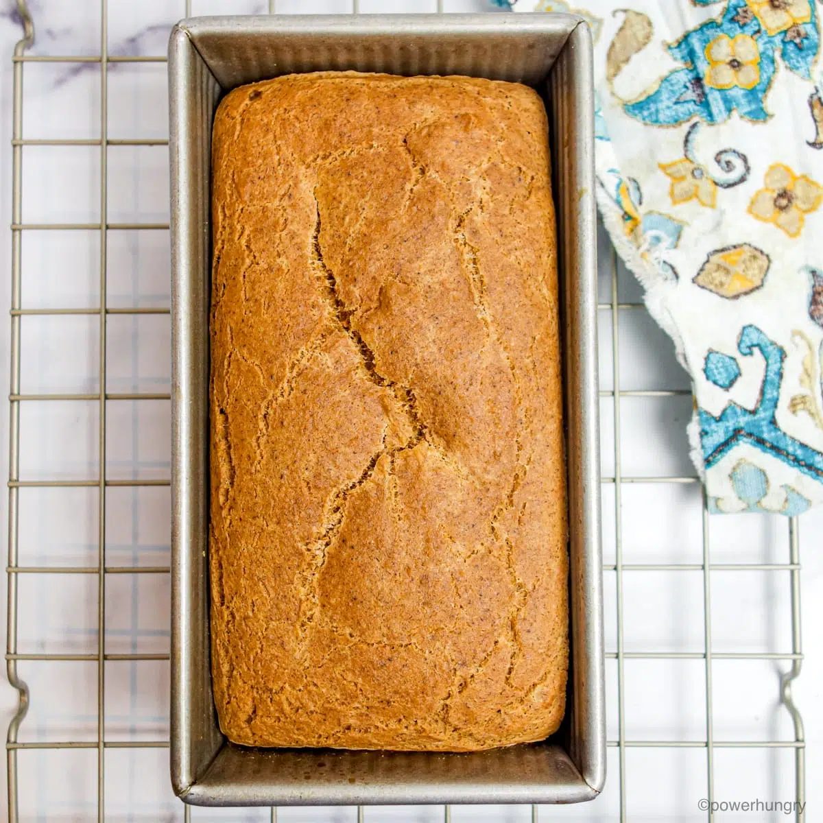 baked loaf of lentil sandwich bread on a cooling rack
