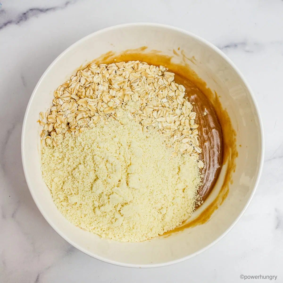 almond flour and oats added to the wet ingredients for oil-free granola