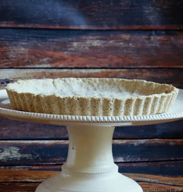tiger nut flour pie crust on a cake stand