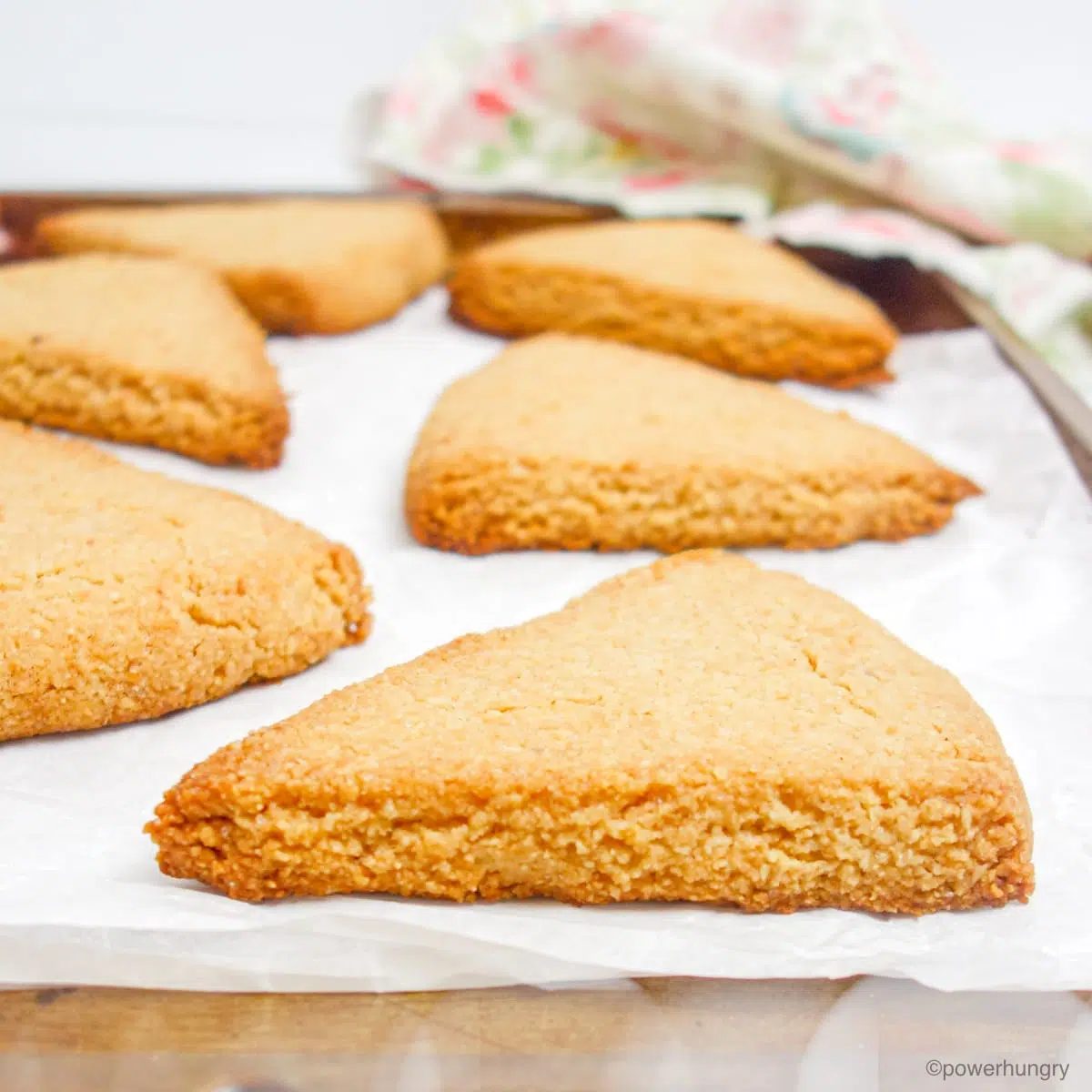 almond flour scones on a baking sheet that is lined with parchment paper