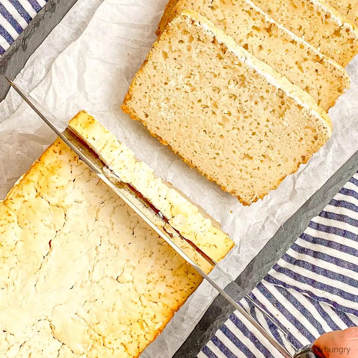 a loaf of rice sandwich bread, getting sliced