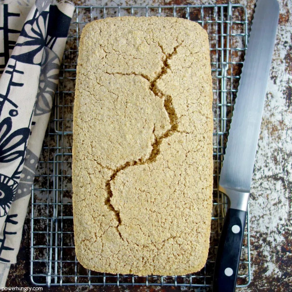 millet oat loaf bread , removed from the pan, on a cooling rack
