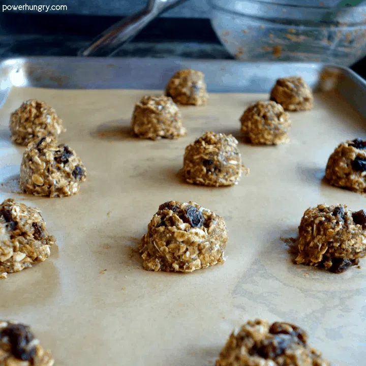 Unbaked Nourishing, flourless oatmeal raisin cookies that are vegan, gluten-free, and oil-free.