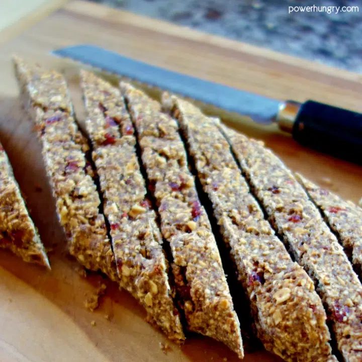 log of baked biscotti dough cut into long diagonal slices