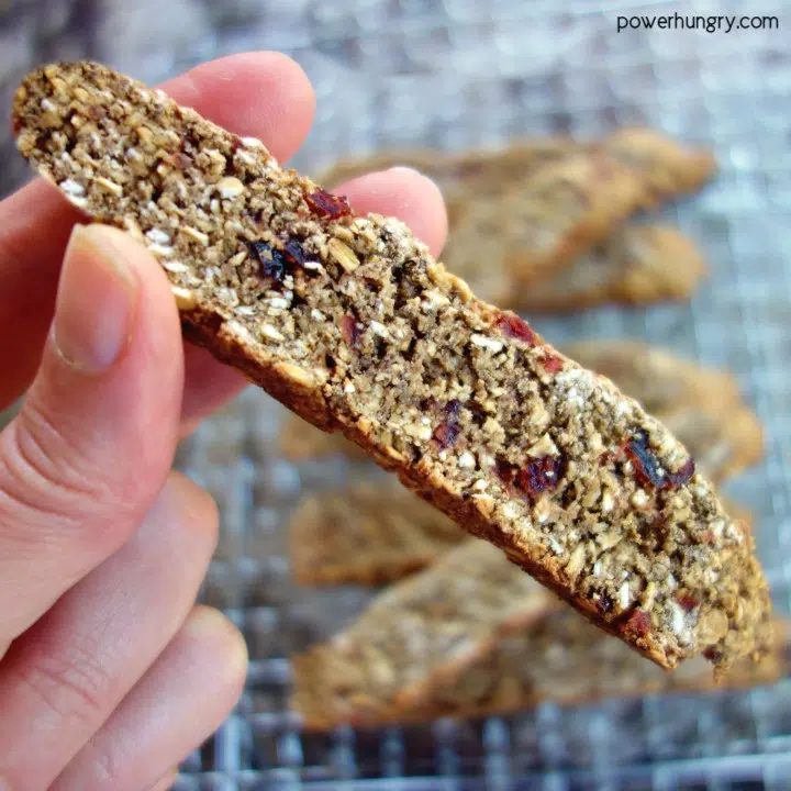 Vegan, flourless oat biscotti being held in hand
