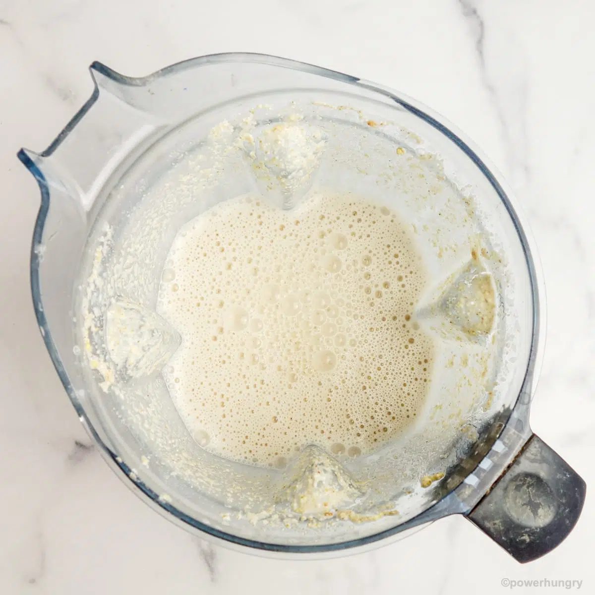 blended grains and water in a blender container