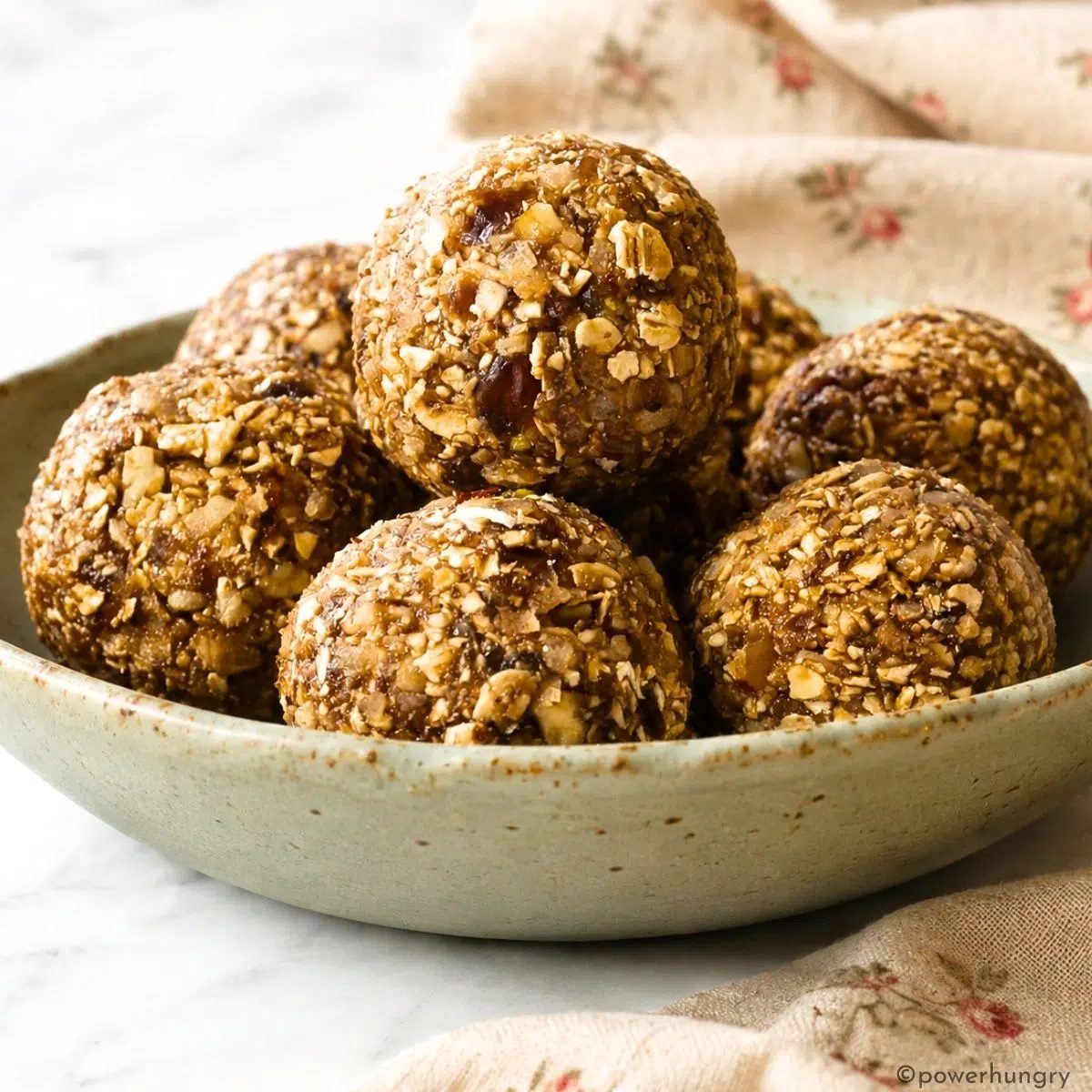 side view of spiced no-balked energy balls in a bowl
