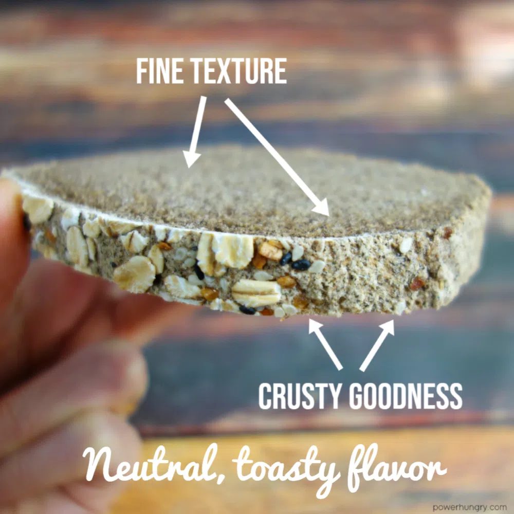 slice of buckwheat bread with oat and seed toppings