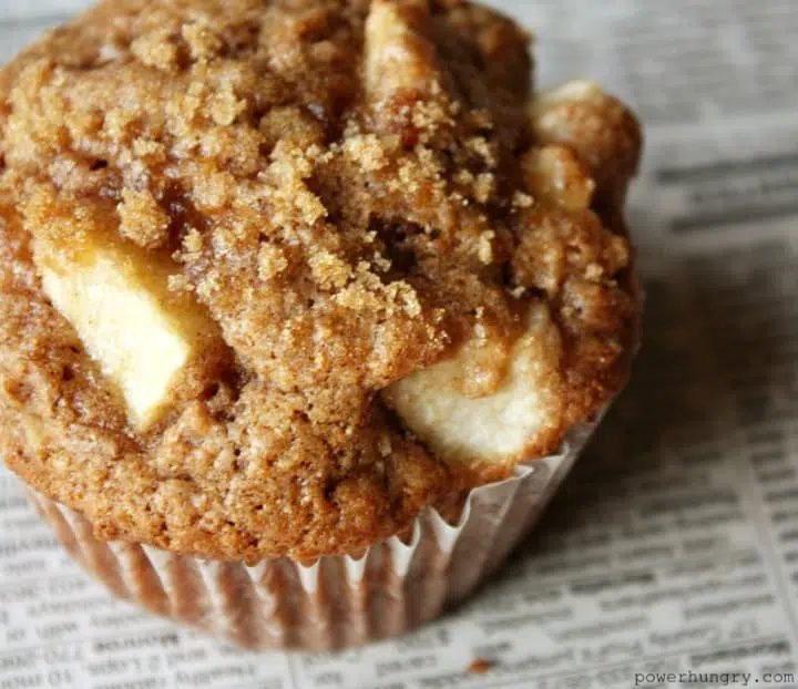 grain-free apple muffin sitting on top of a newspaper