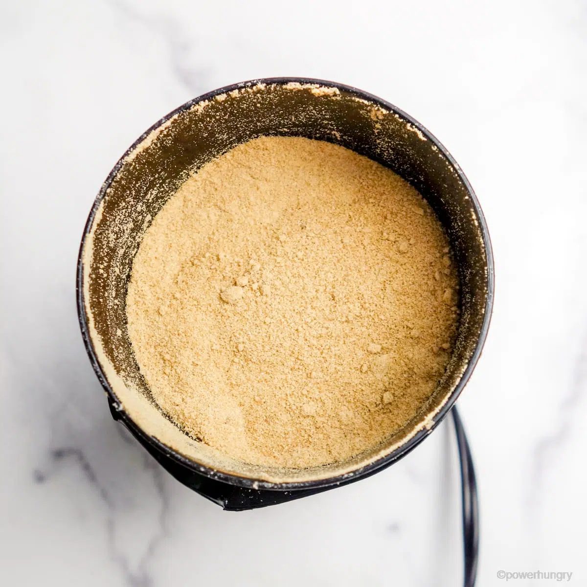 coffee grainder filled withfinely blended coconut sugar and tapioca starch