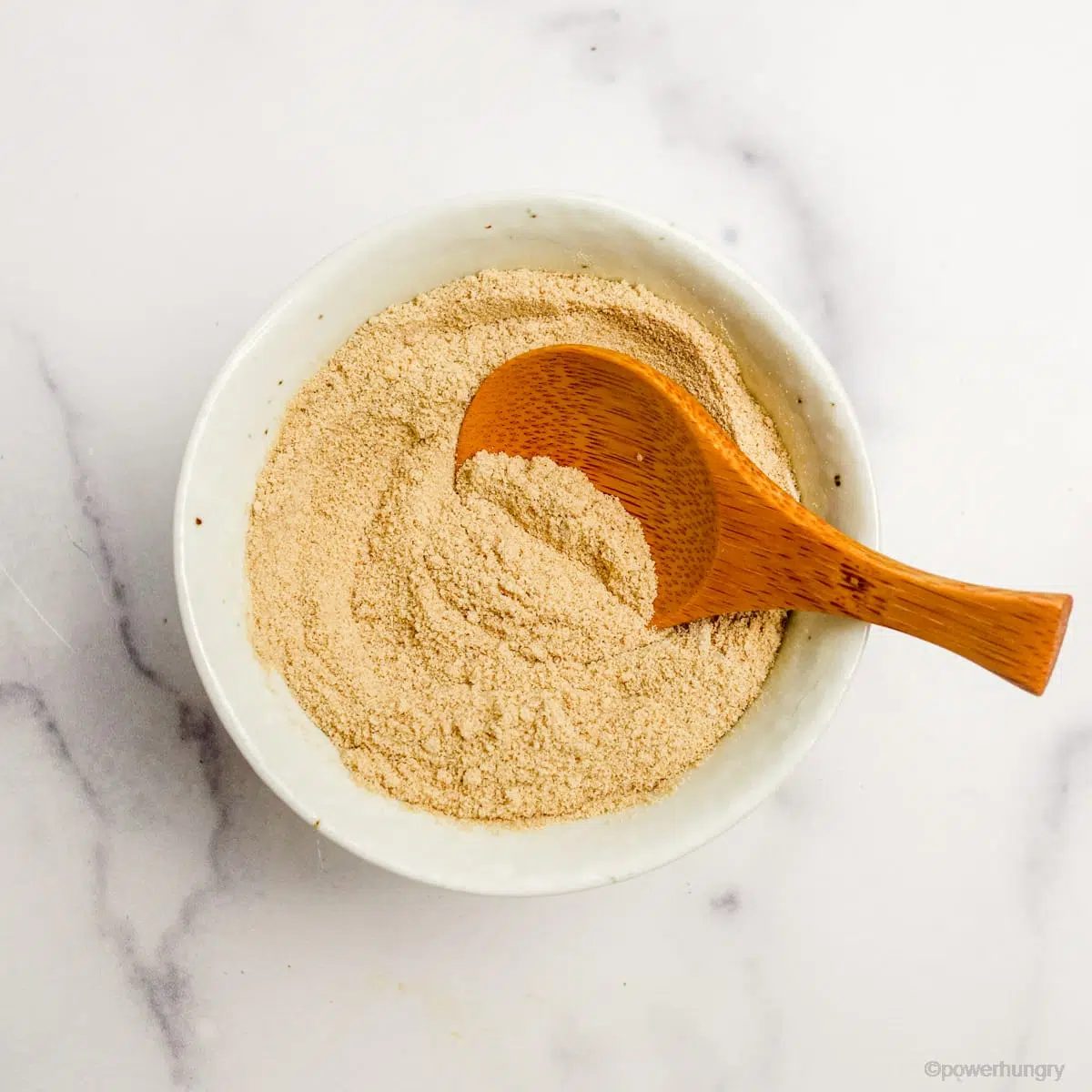 coconut sugar powdered sugar in a white bowl