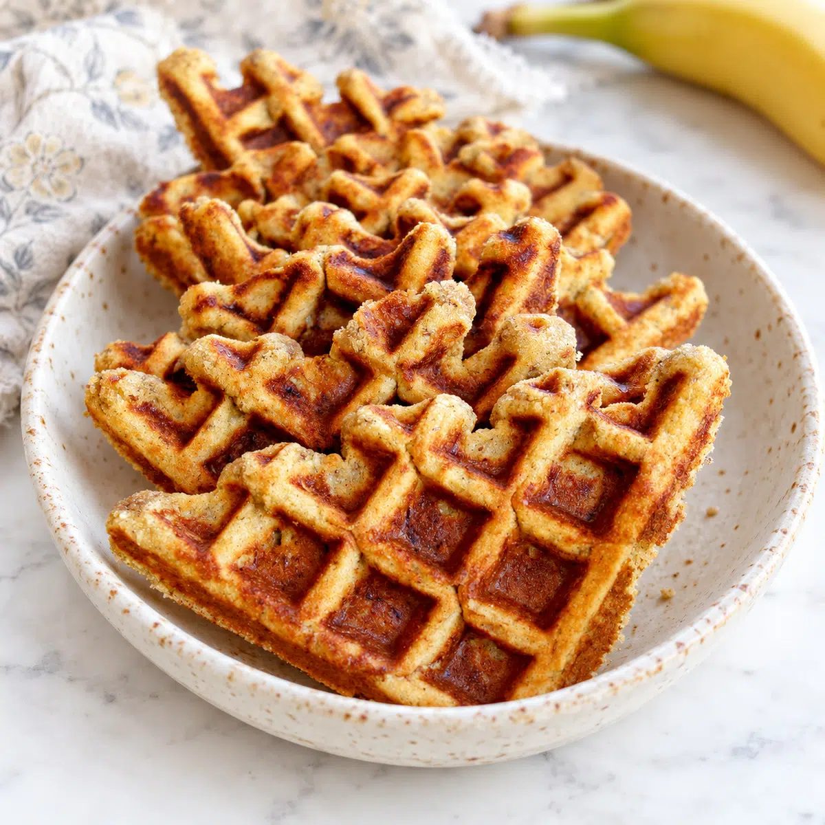 almond flour banana waffles, quartered, in a bowl