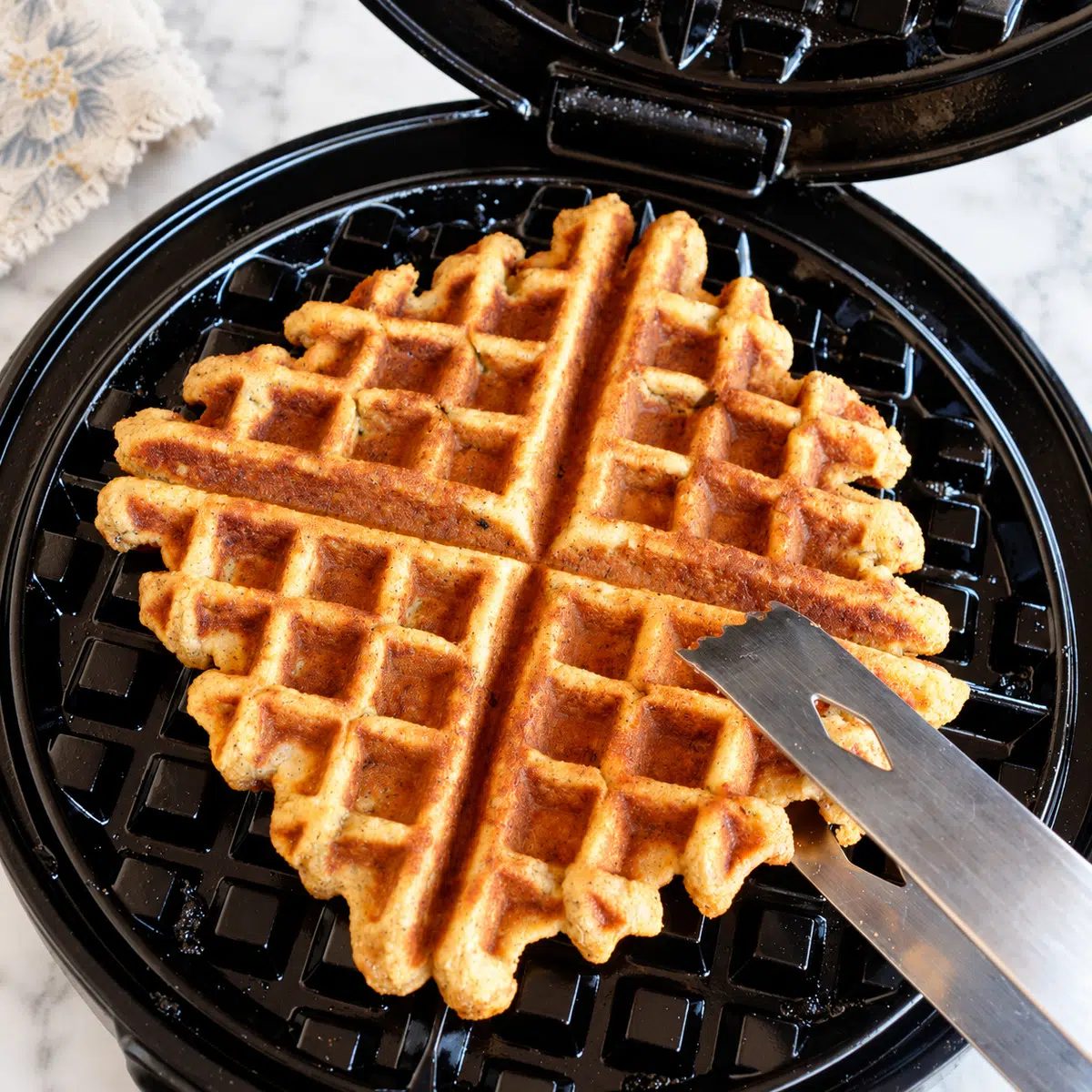 almond flour banana waffles in waffle iron