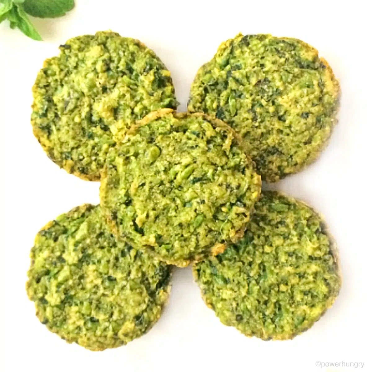 overhead shot of 5 Supergreen baked falafel patties