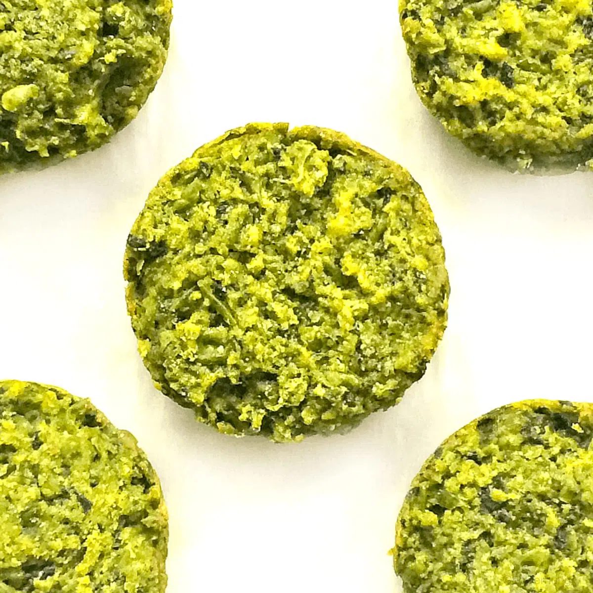 overhead shot of 5 Supergreen baked falafel patties