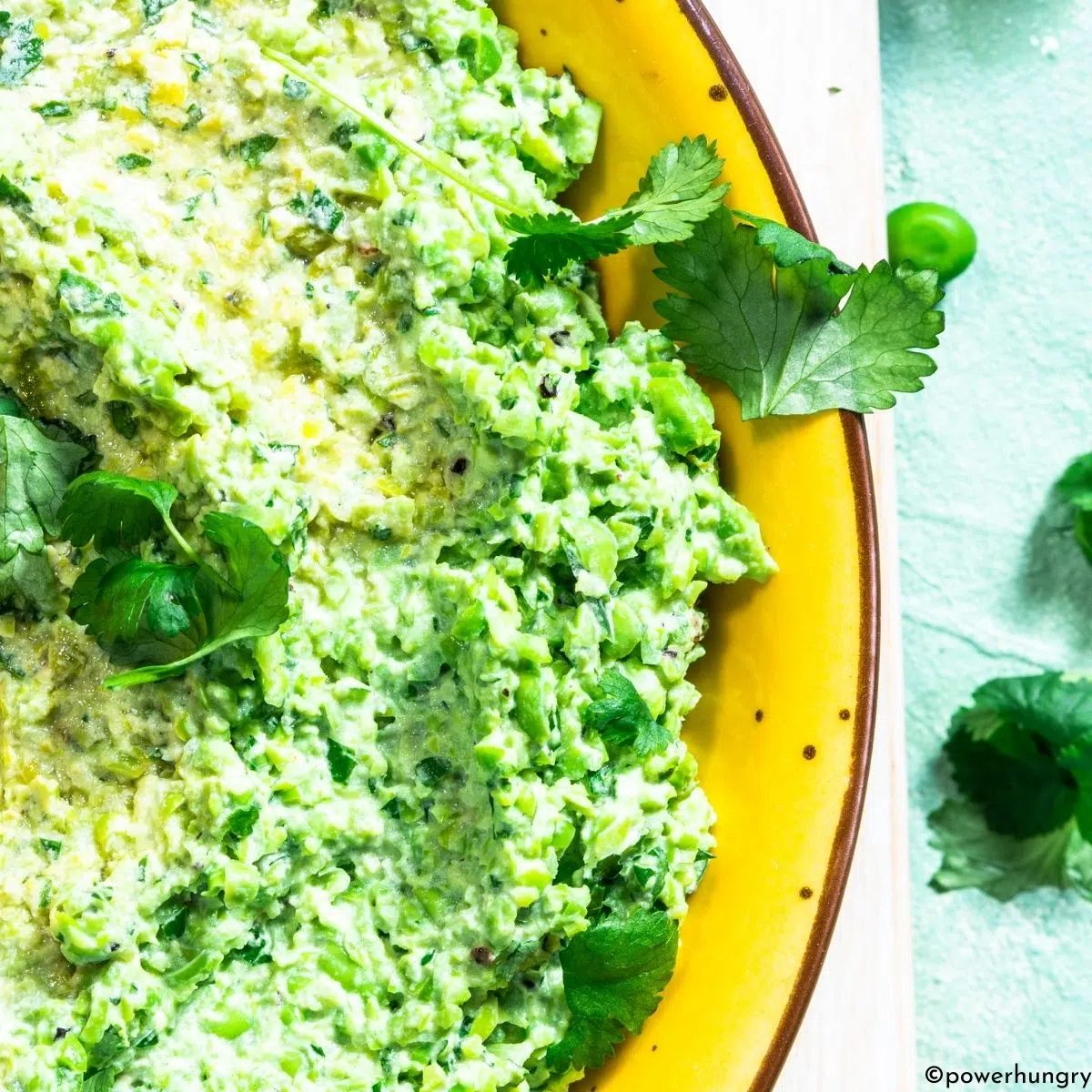 close up of green pea guacamole