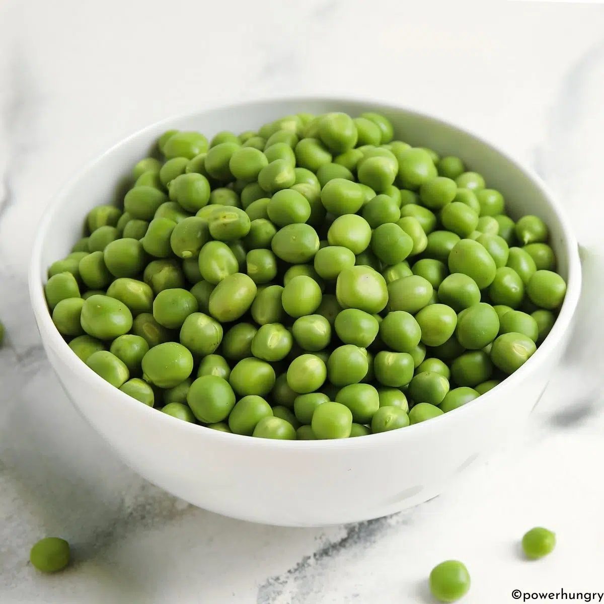green peas in a white bowl