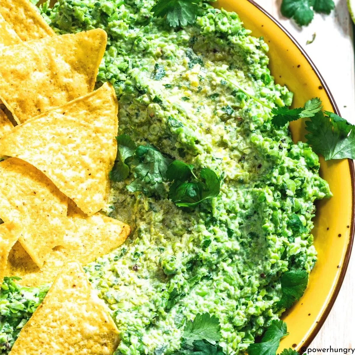 green pea guacamole in a bowl