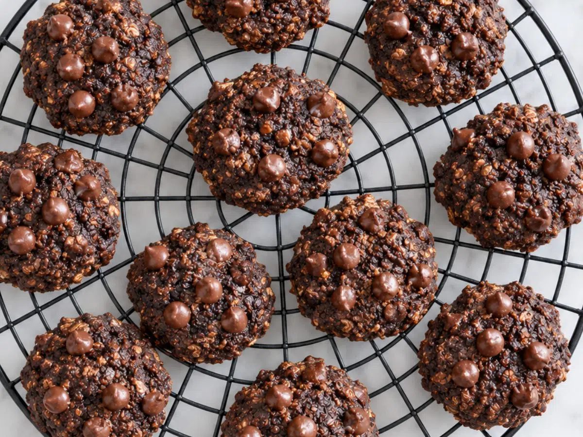 chocolate banana oat cookies on a round black cooling rack