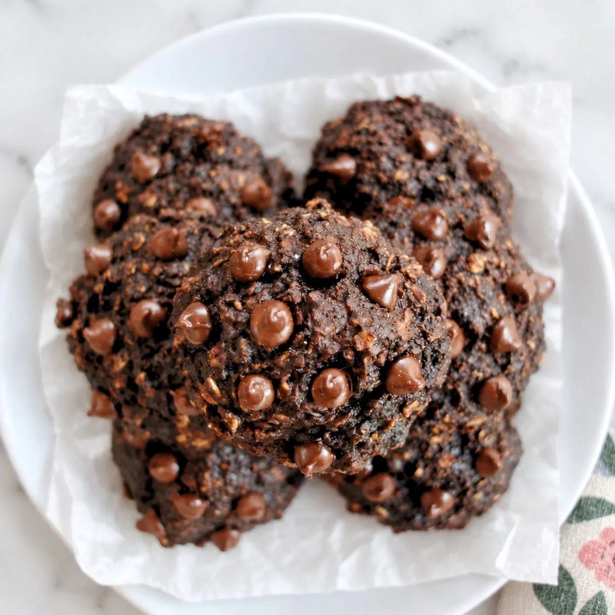 overhead shot of a plate full of chocolate banana oat cookies