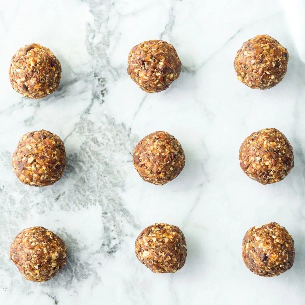 hemp protein balls on marble surface
