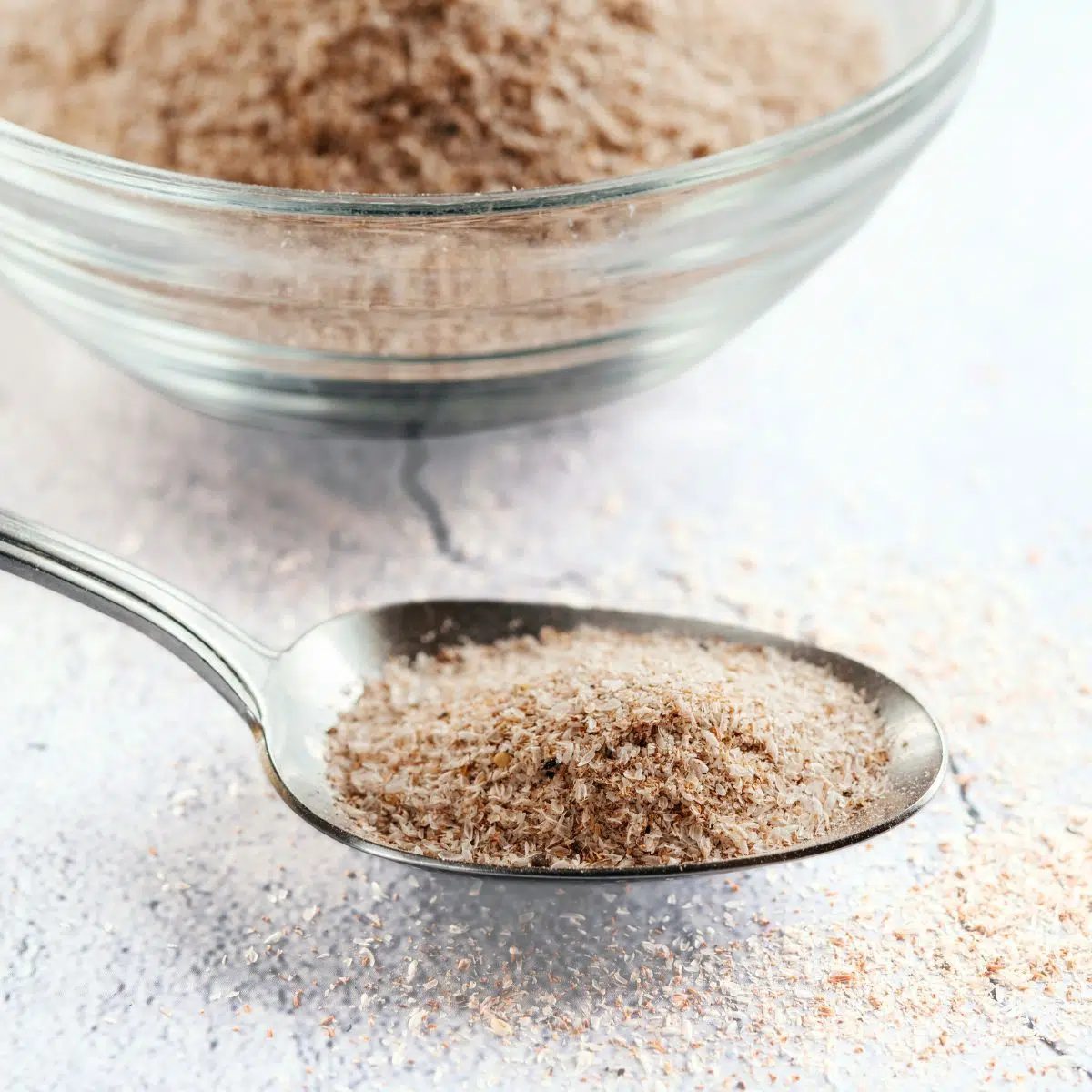 psyllium husks in a silver spoon