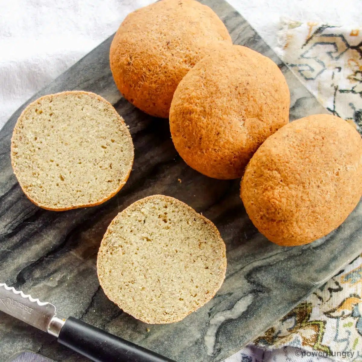 lentil bread rolls on a grey marble cutting board