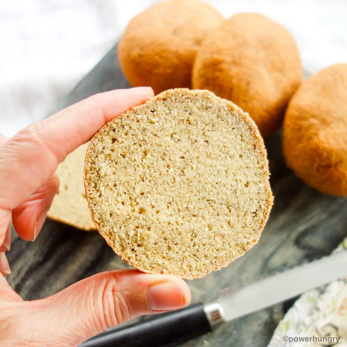 lentil bread roll being held by woman's hand