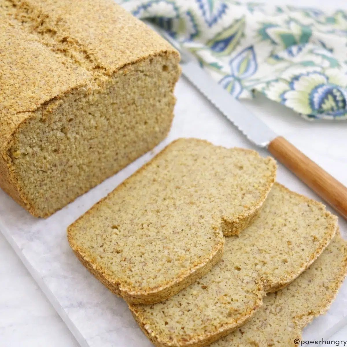 sliced high protein millet bread on a cutting board