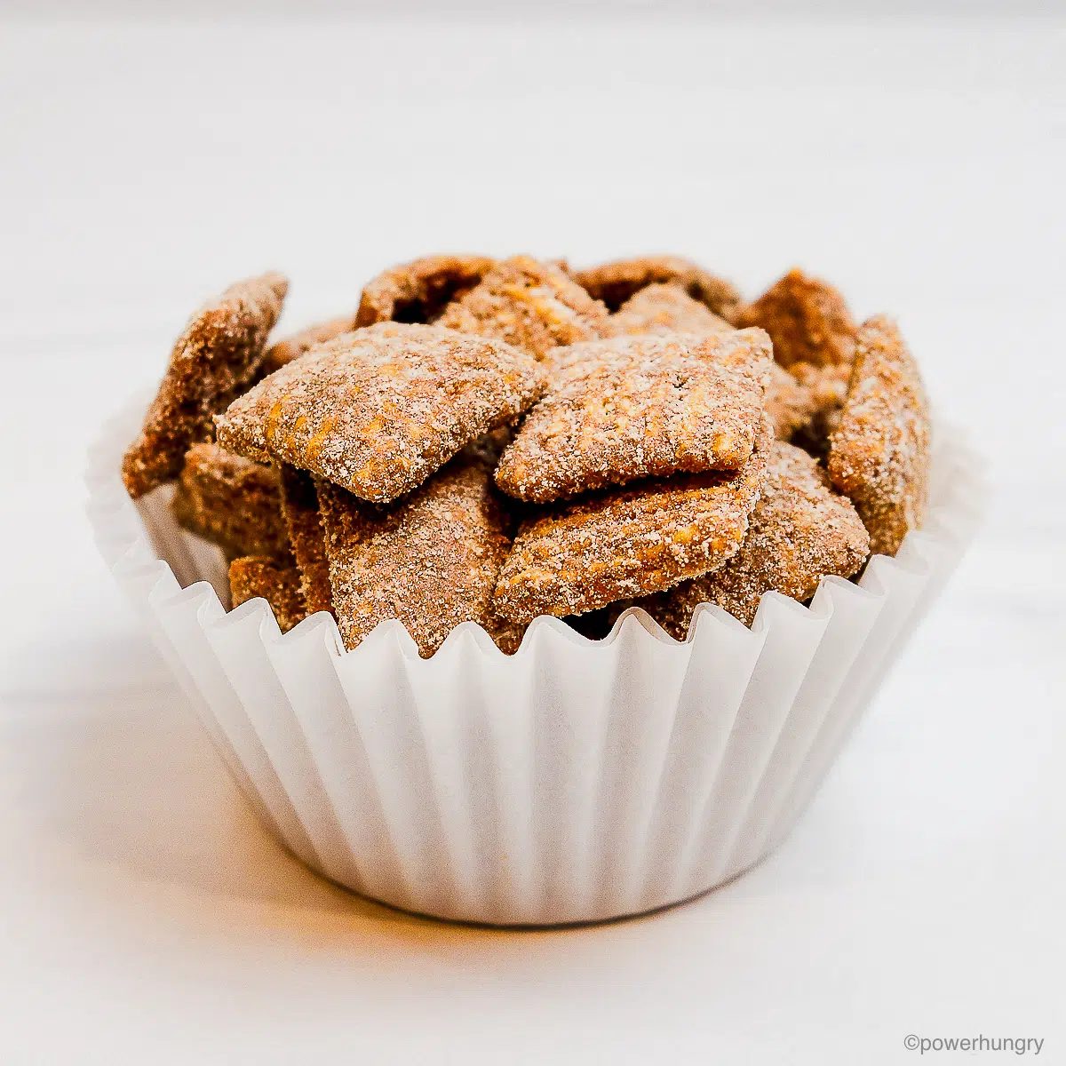 white silicone cup filled with puppy chow