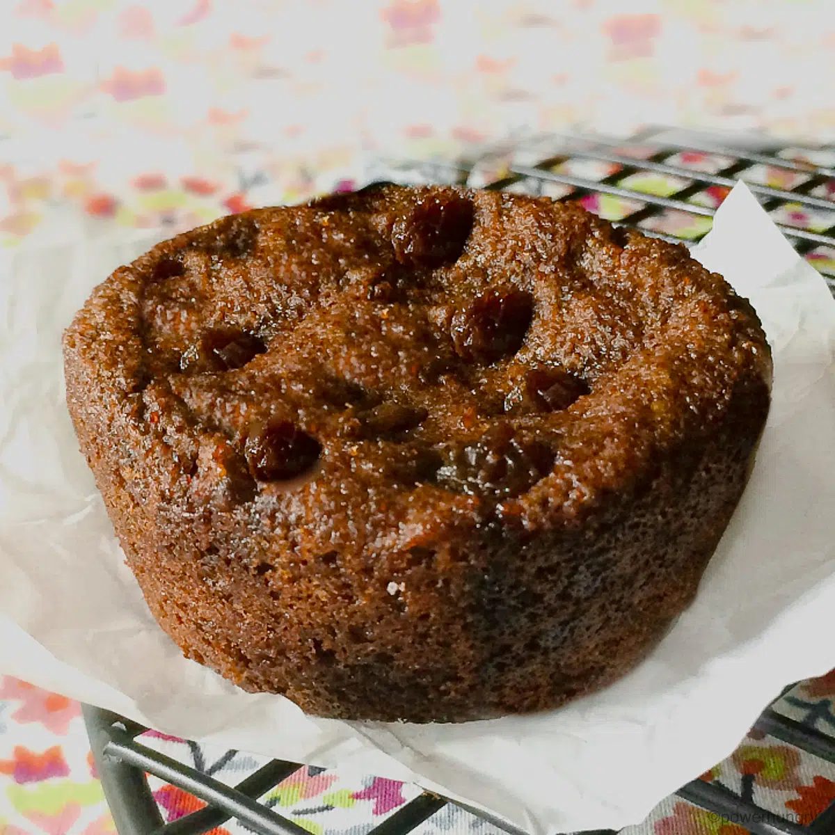 high protein teff raisin bread on a piece of parchment paper
