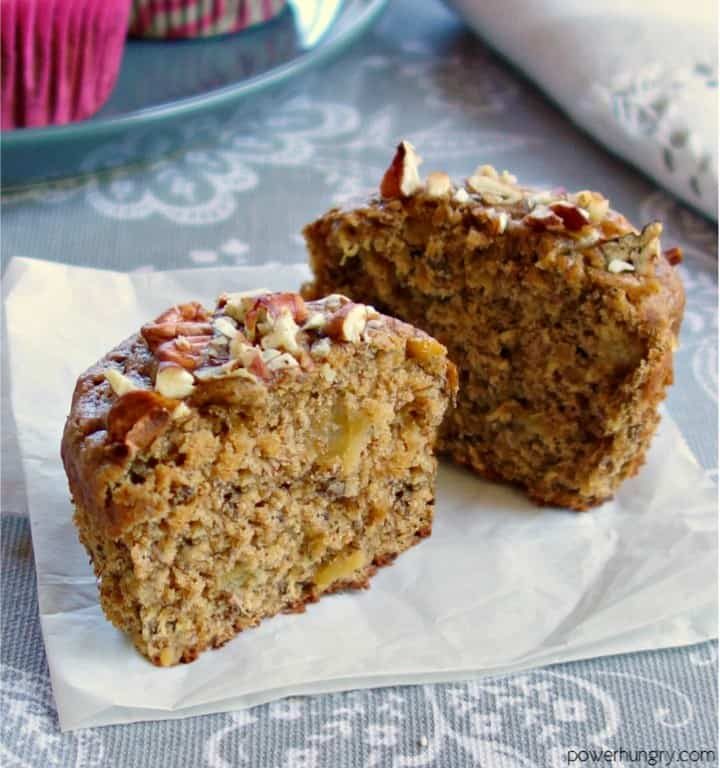 close up of a vegan hummingbird muffin, cut in half, on a piece of parchment paper