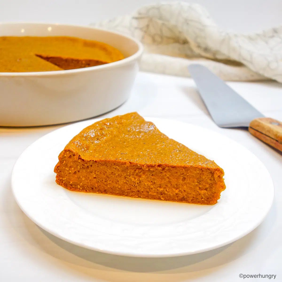oat pumpkin pie on slice of white plate